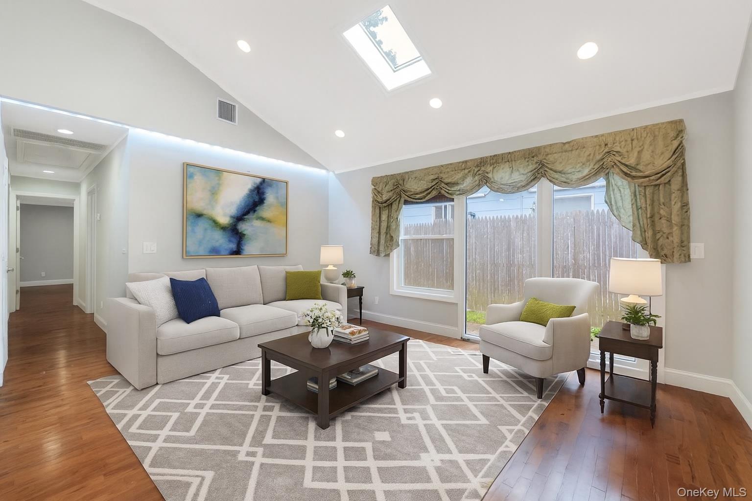 30 Harding Road Ronkonkoma, NY 11779 - Photo 14 of 38 a living room with furniture and a large window