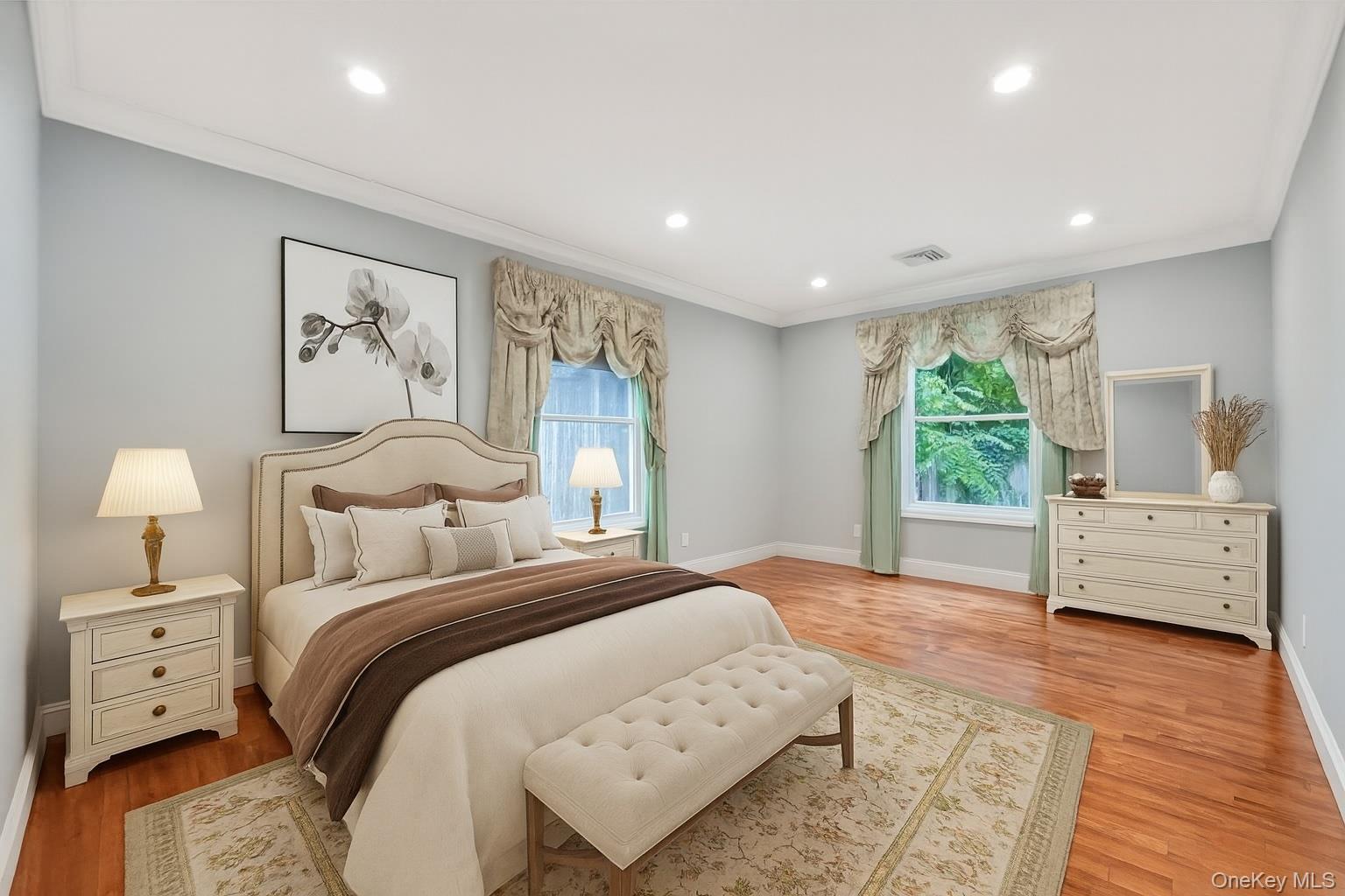 30 Harding Road Ronkonkoma, NY 11779 - Photo 20 of 38 a spacious bedroom with a large bed and a window