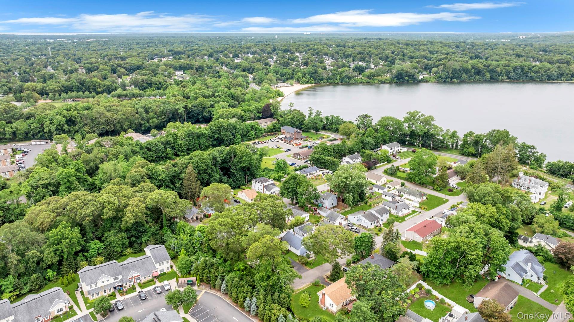 30 Harding Road Ronkonkoma, NY 11779 - Photo 2 of 38 a view of a lake and mountain