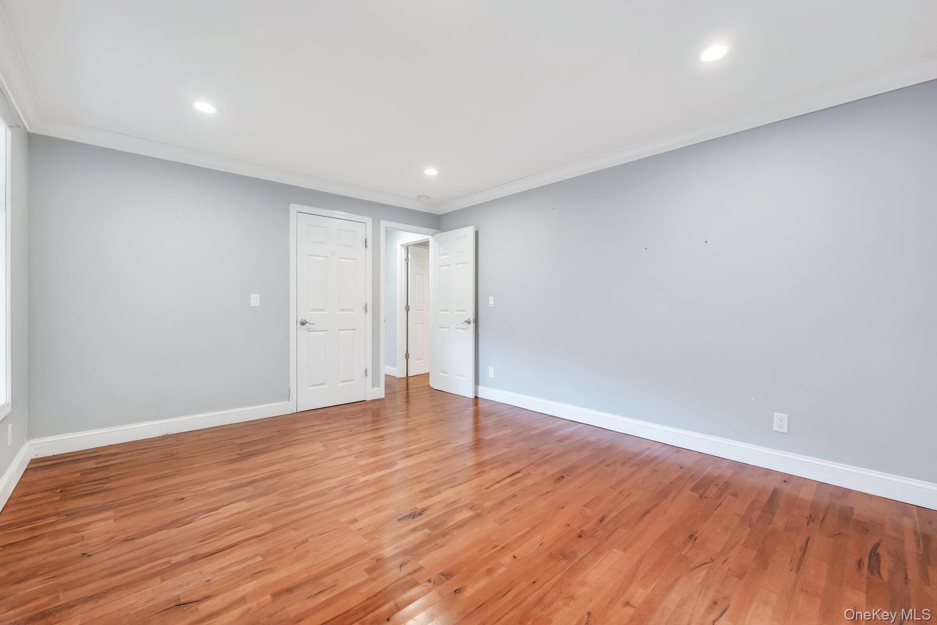 30 Harding Road Ronkonkoma, NY 11779 - Photo 27 of 38 a view of an empty room with wooden floor