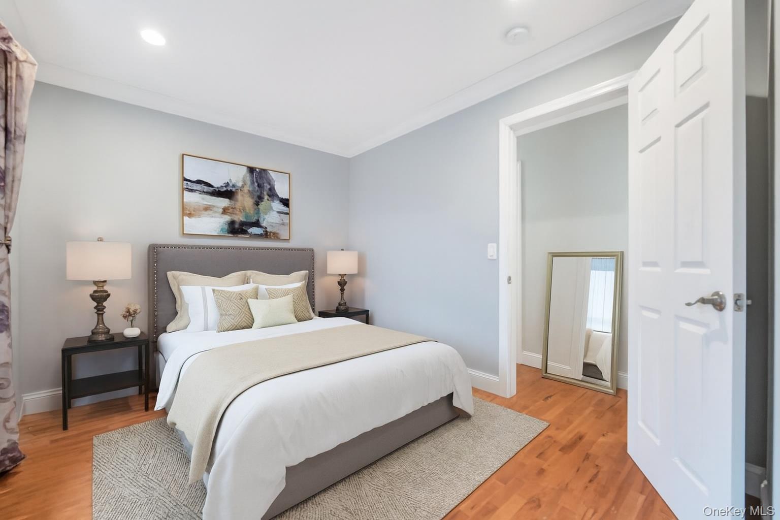 30 Harding Road Ronkonkoma, NY 11779 - Photo 29 of 38 a bedroom with a bed and a painting on the wall