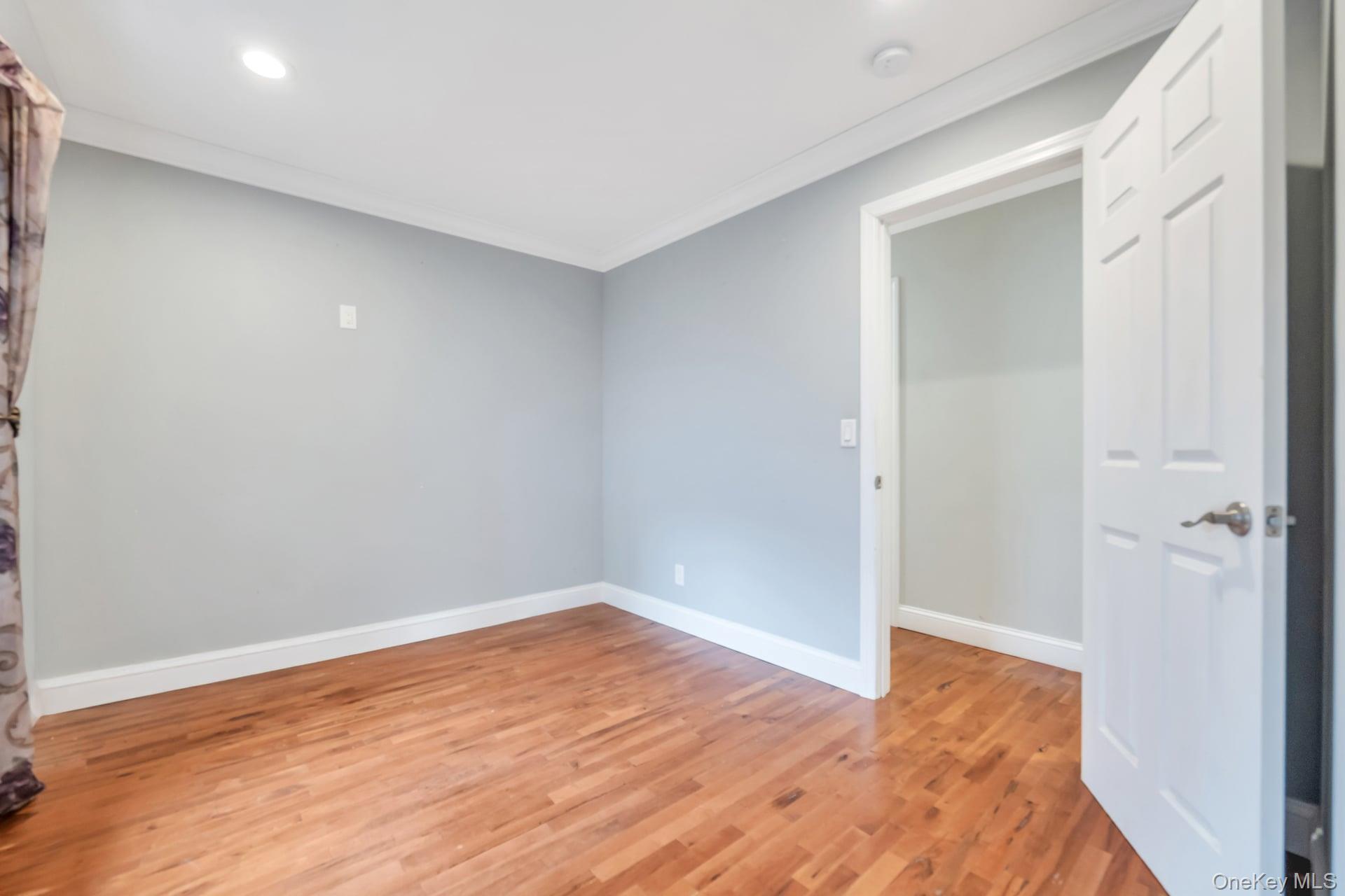 30 Harding Road Ronkonkoma, NY 11779 - Photo 30 of 38 a view of an empty room with wooden floor