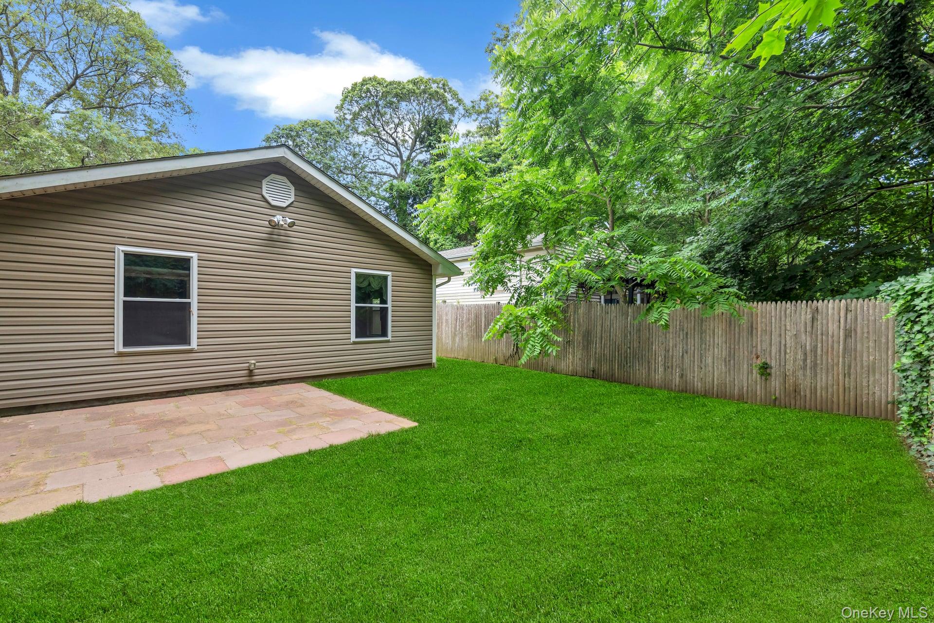 30 Harding Road Ronkonkoma, NY 11779 - Photo 32 of 38 a view of a backyard with a garden