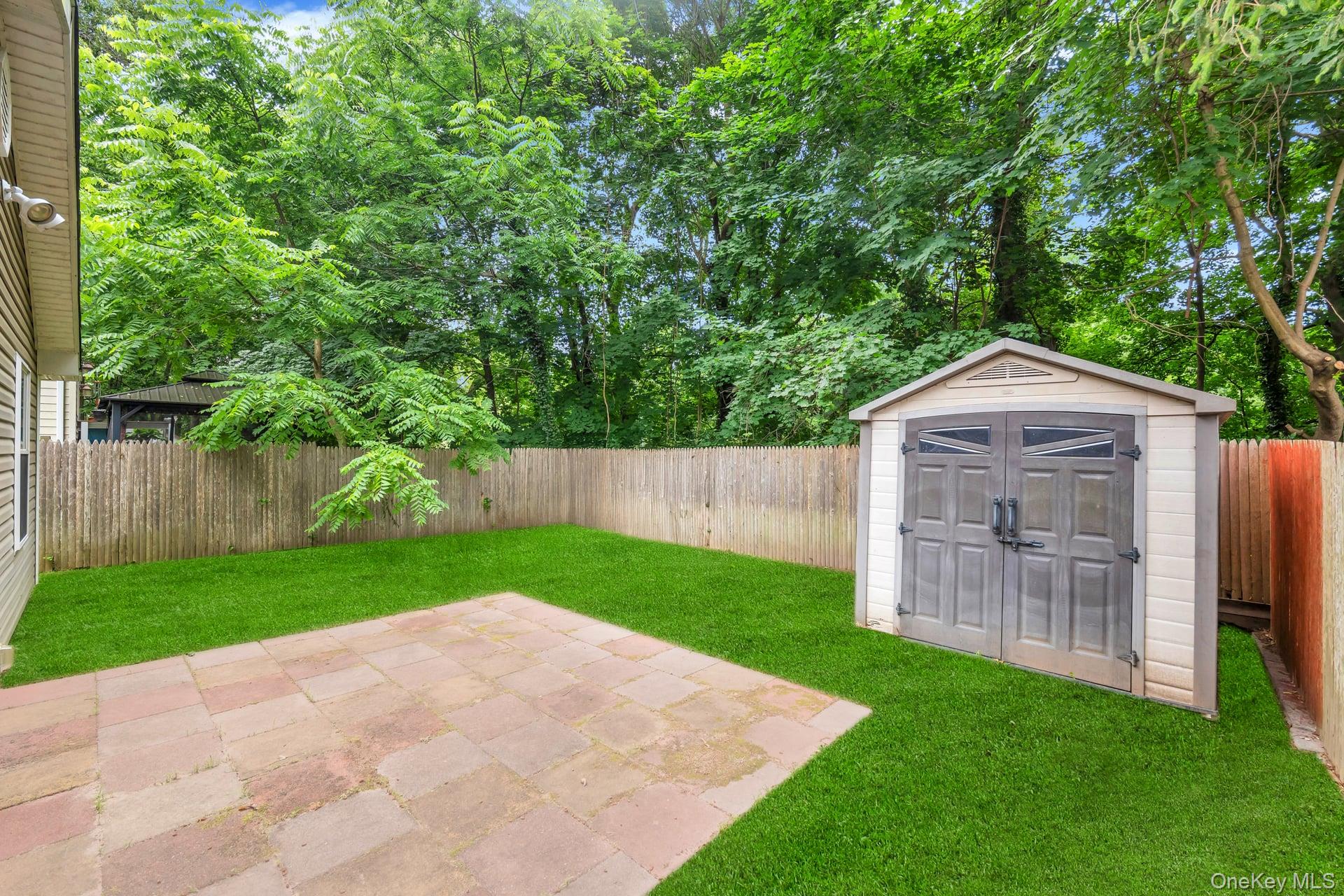 30 Harding Road Ronkonkoma, NY 11779 - Photo 33 of 38 a view of an house with backyard space and garden