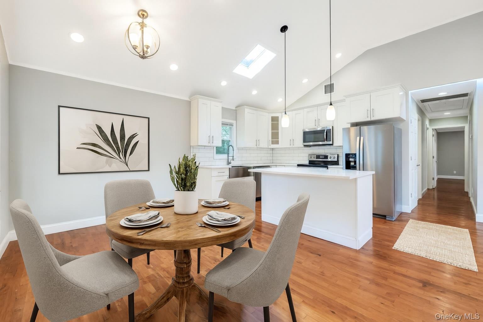 30 Harding Road Ronkonkoma, NY 11779 - Photo 5 of 38 a view of a dining room with furniture wooden floor and kitchen view