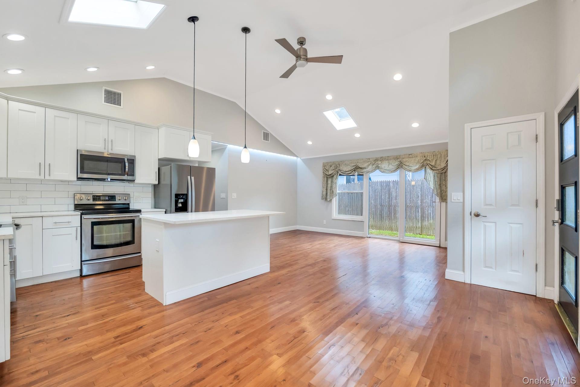 30 Harding Road Ronkonkoma, NY 11779 - Photo 9 of 38 a view of kitchen with stainless steel appliances refrigerator stove microwave and cabinets