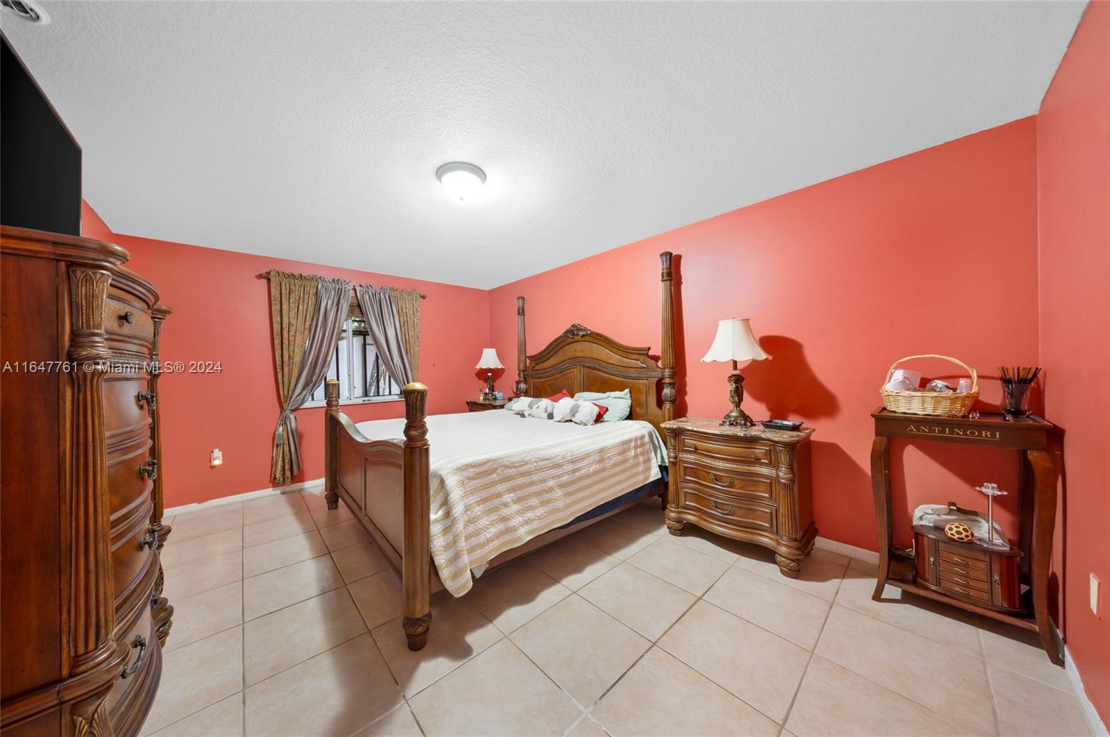 12431 Southwest 220th Street Miami, FL 33170 - Photo 17 of 34 a bedroom with a bed and a view of bedroom