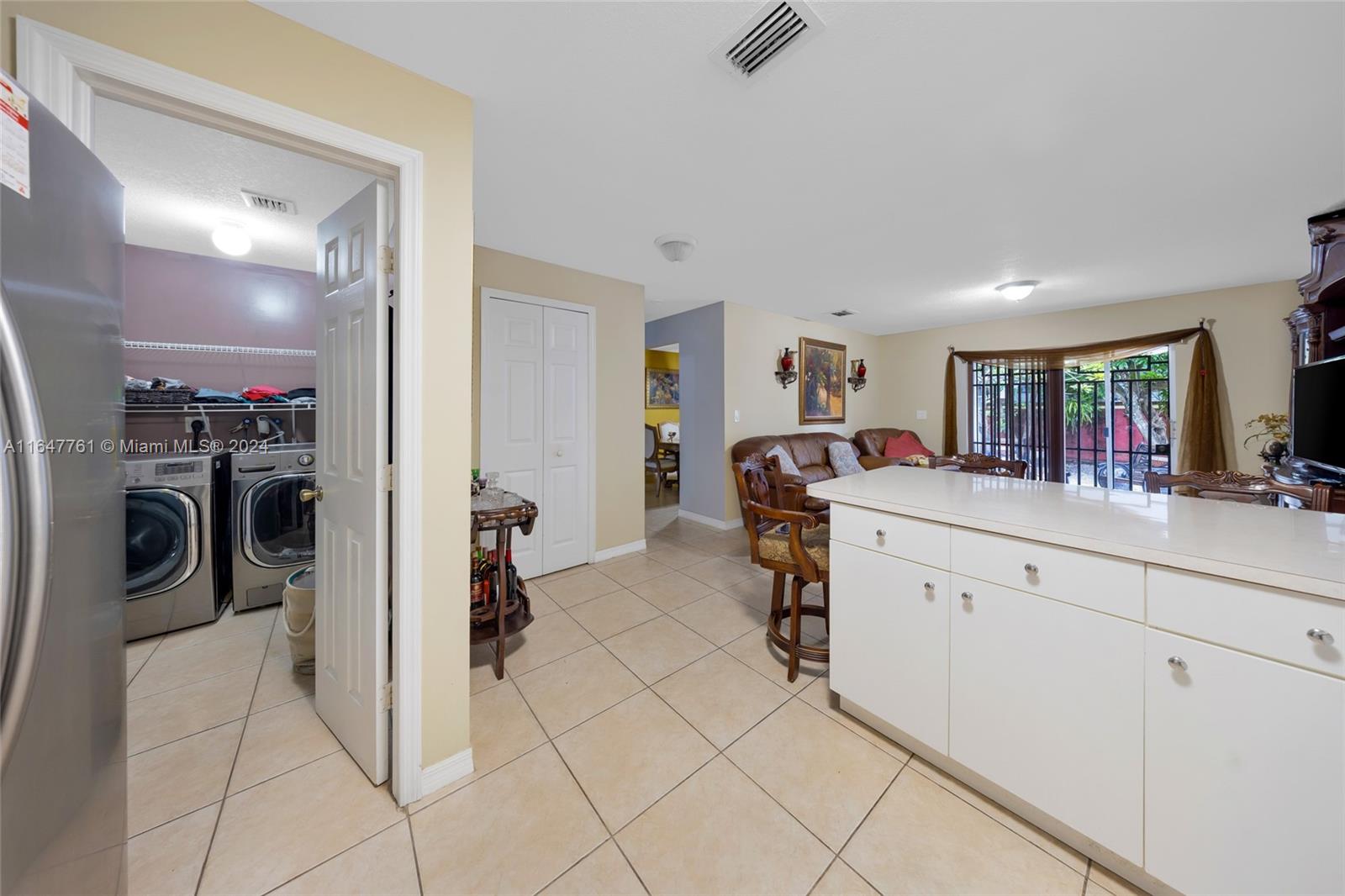 12431 Southwest 220th Street Miami, FL 33170 - Photo 23 of 34 a bed room with a bed and a mirror