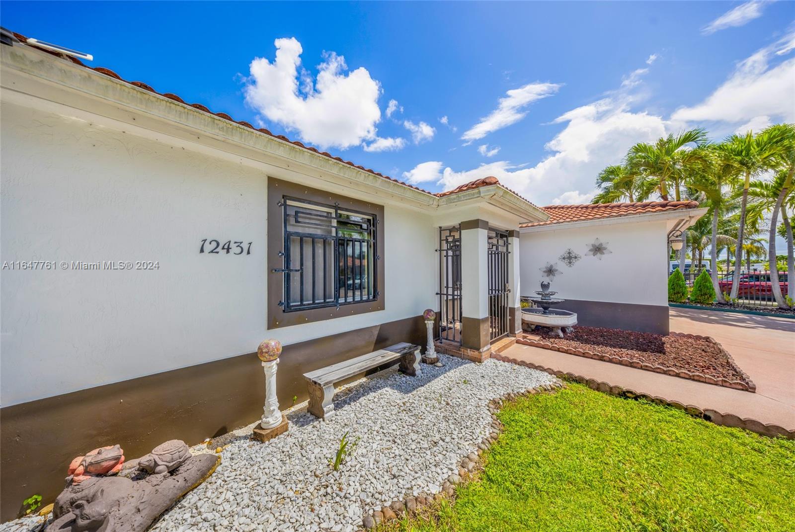 12431 Southwest 220th Street Miami, FL 33170 - Photo 3 of 34 a house view with a sitting space and garden space
