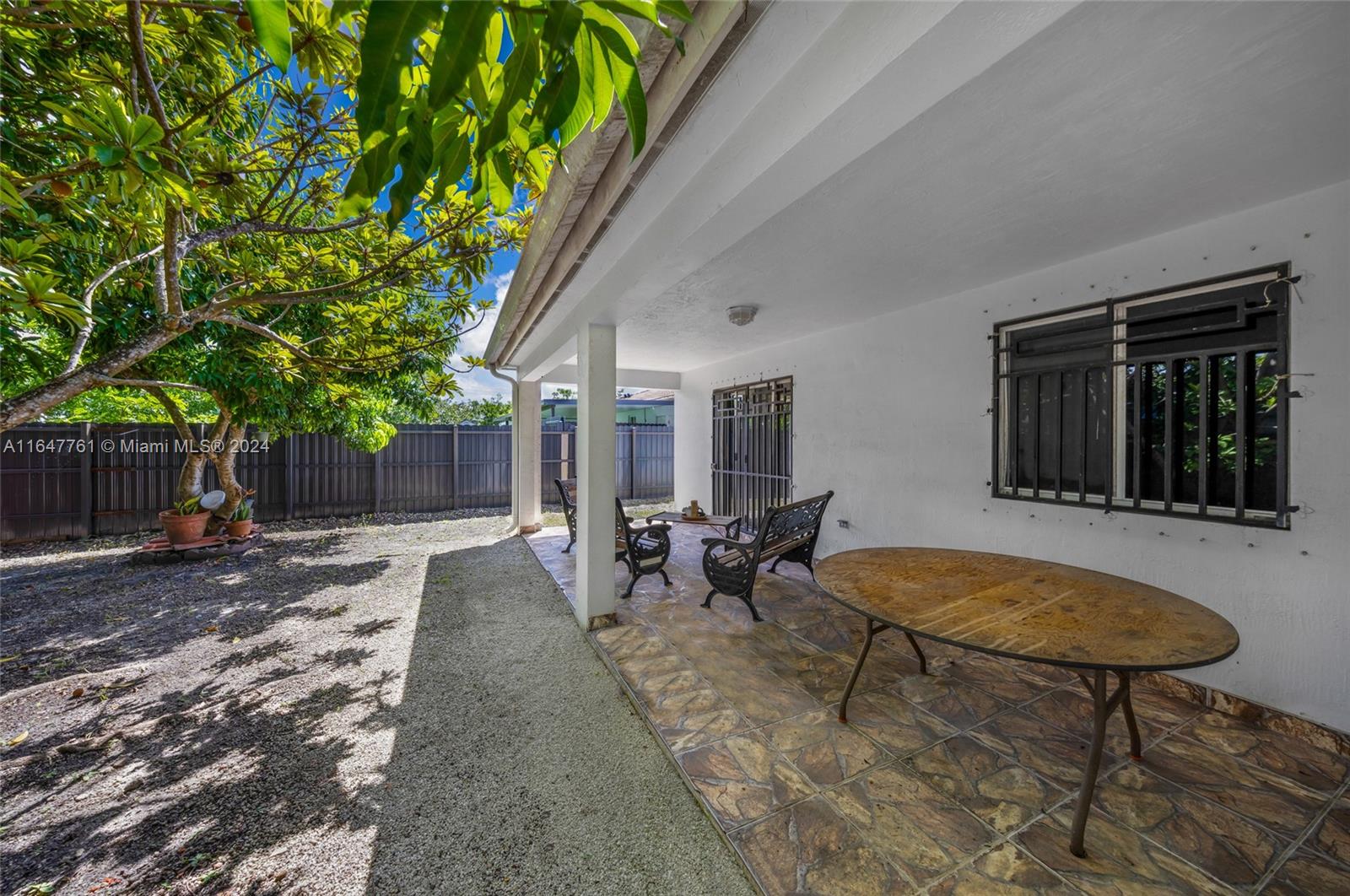 12431 Southwest 220th Street Miami, FL 33170 - Photo 33 of 34 a view of a house with backyard and sitting area