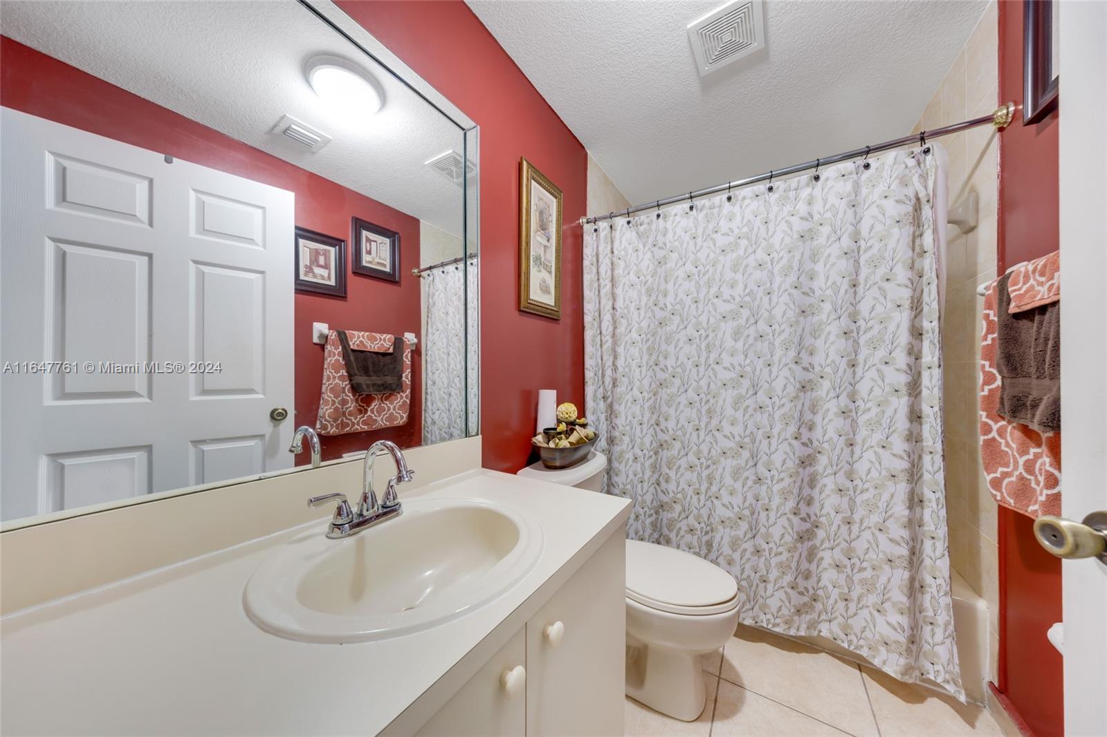 12431 Southwest 220th Street Miami, FL 33170 - Photo 34 of 34 a bathroom with a sink toilet and shower