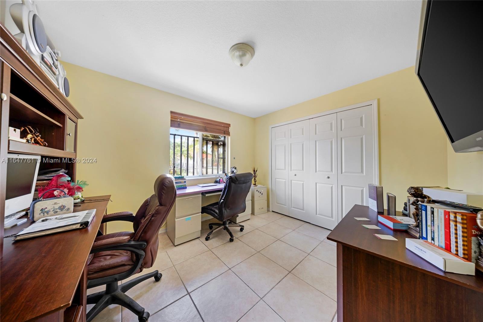 12431 Southwest 220th Street Miami, FL 33170 - Photo 10 of 34 a view of a workspace with furniture and toys
