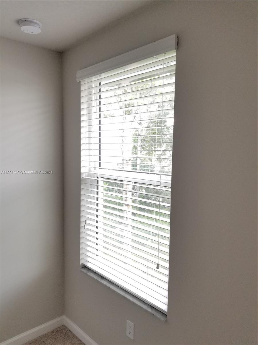 a view of a window in an empty room