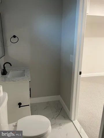 a bathroom with a toilet and a sink