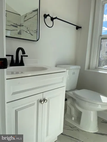 a bathroom with a toilet and a sink