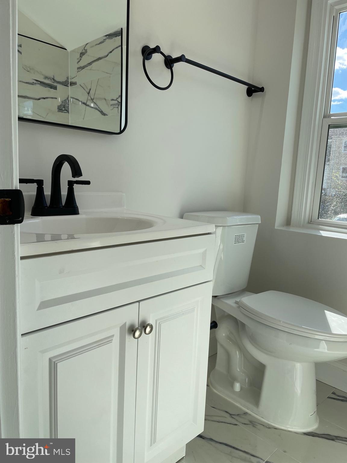 136 Old Enterprise Road, Unit 131 Upper Marlboro, MD 20774 - Photo 7 of 36 a bathroom with a toilet and a sink