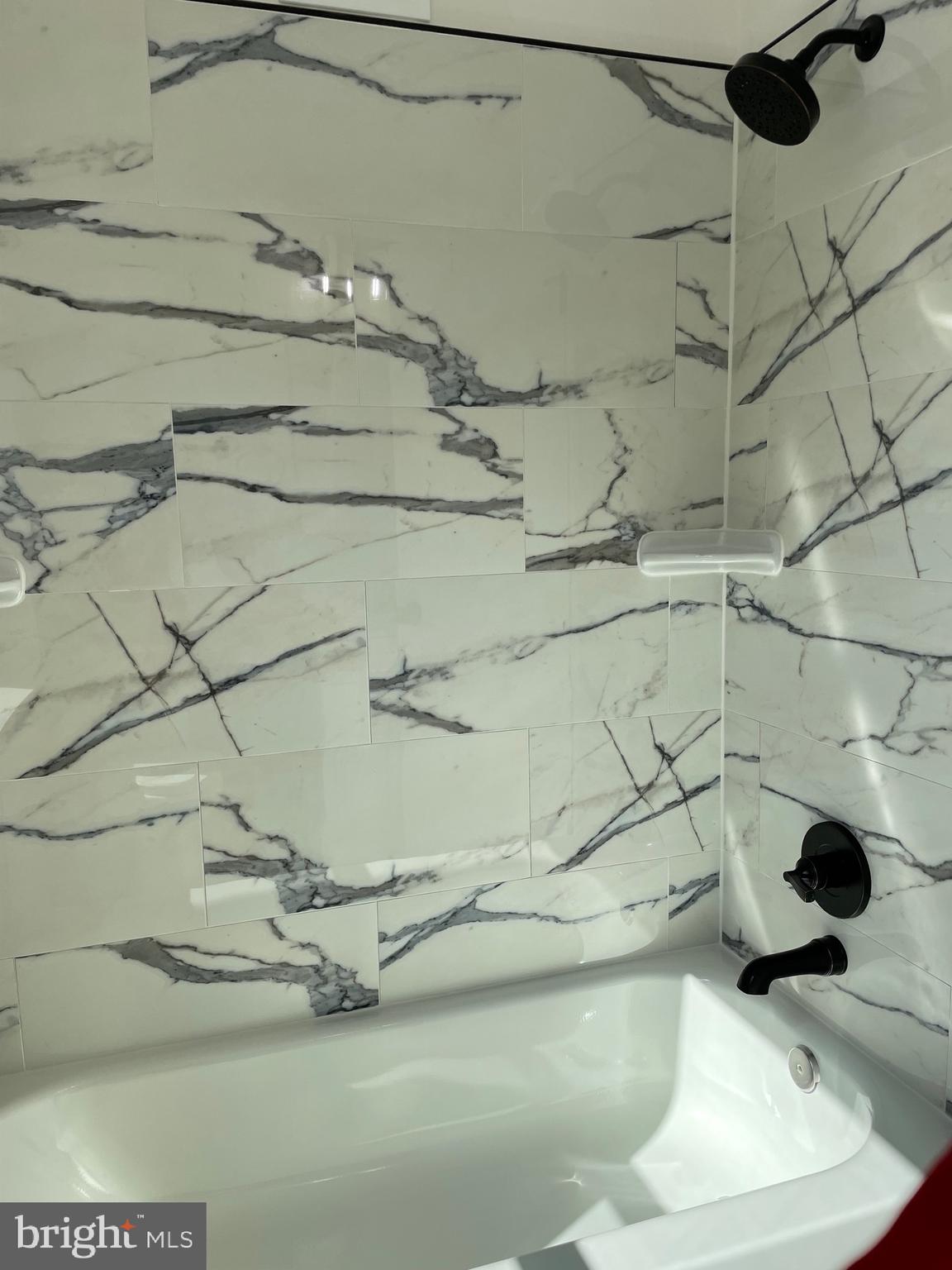 136 Old Enterprise Road, Unit 131 Upper Marlboro, MD 20774 - Photo 9 of 36 a dirty bathroom with a bathtub