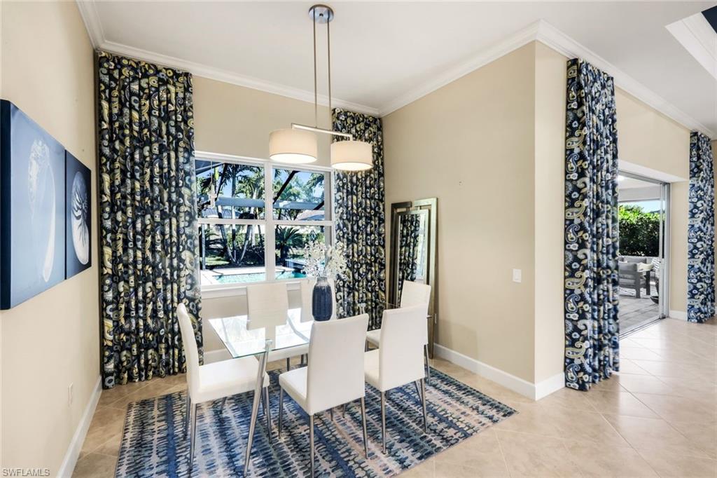 9314 Quarry Drive Naples, FL 34120 - Photo 17 of 49 a view of a dining room with furniture window and front door