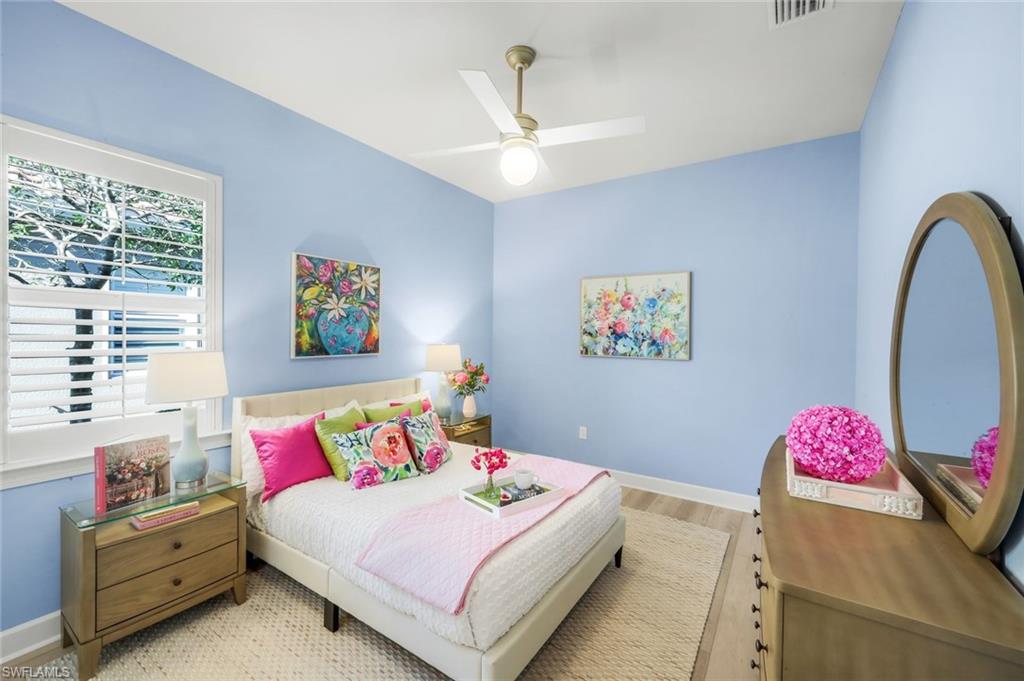 9314 Quarry Drive Naples, FL 34120 - Photo 26 of 49 a bedroom with a bed and a dresser