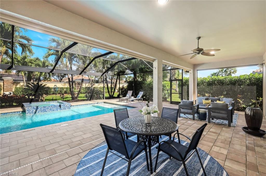 9314 Quarry Drive Naples, FL 34120 - Photo 30 of 49 a view of an outdoor dining space with a table and chairs