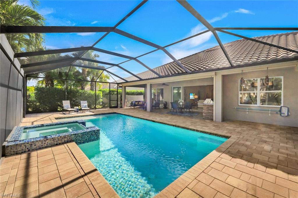 9314 Quarry Drive Naples, FL 34120 - Photo 36 of 49 a view of swimming pool with outdoor seating