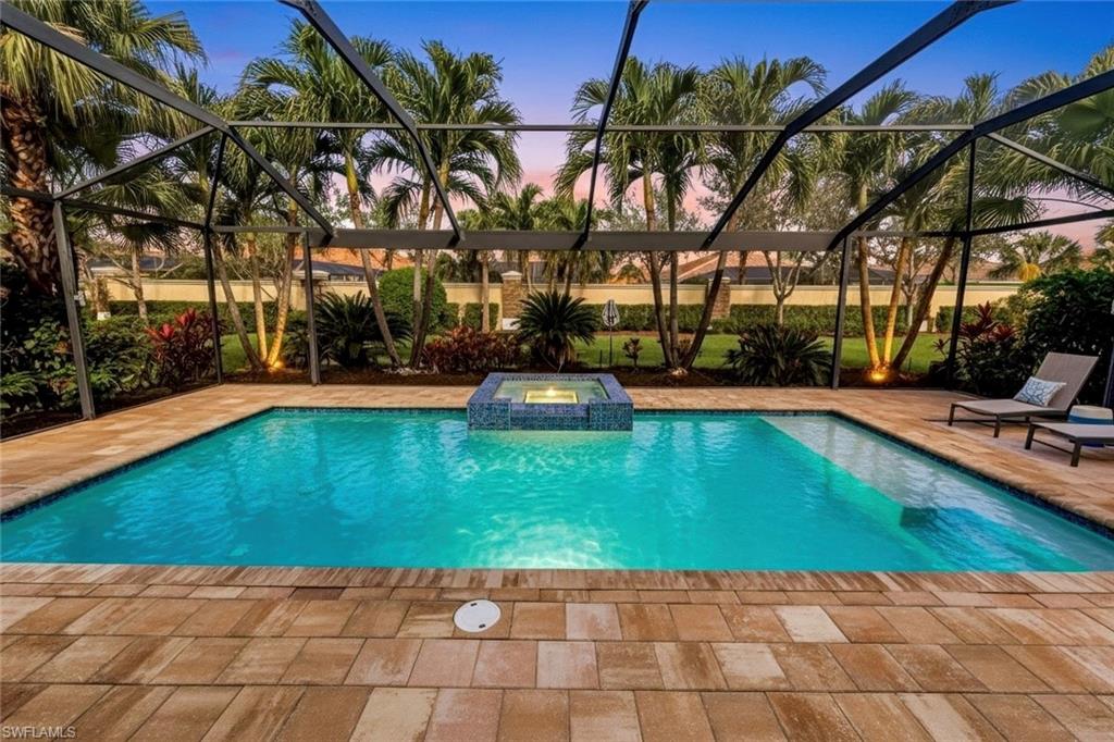 9314 Quarry Drive Naples, FL 34120 - Photo 4 of 49 a view of a backyard with swimming pool