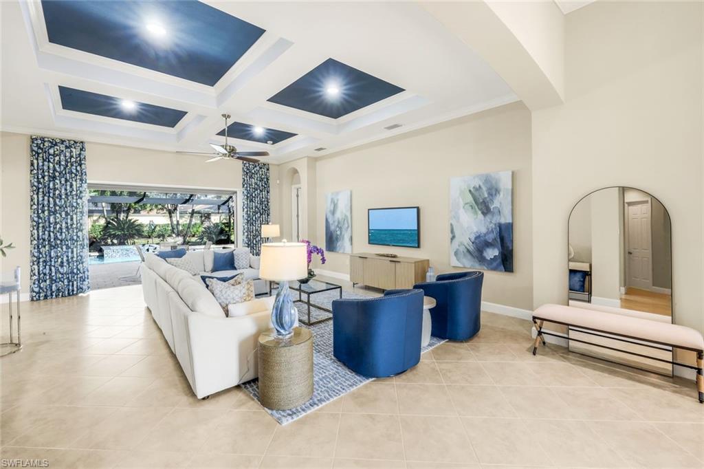 9314 Quarry Drive Naples, FL 34120 - Photo 9 of 49 a living room with furniture and a window