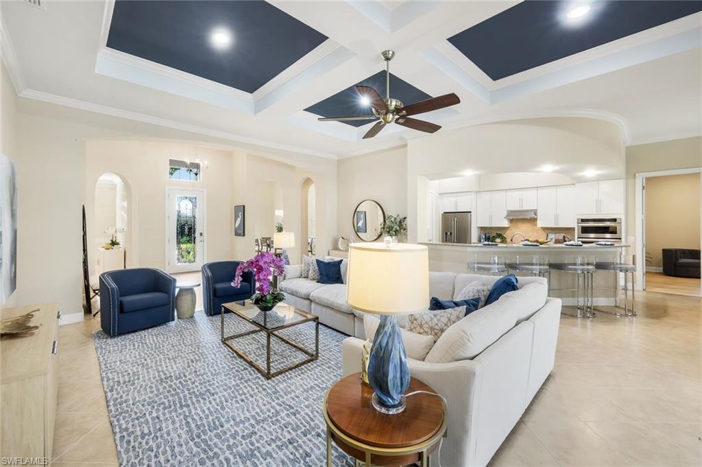 9314 Quarry Drive Naples, FL 34120 - Photo 10 of 49 a living room with furniture and kitchen view
