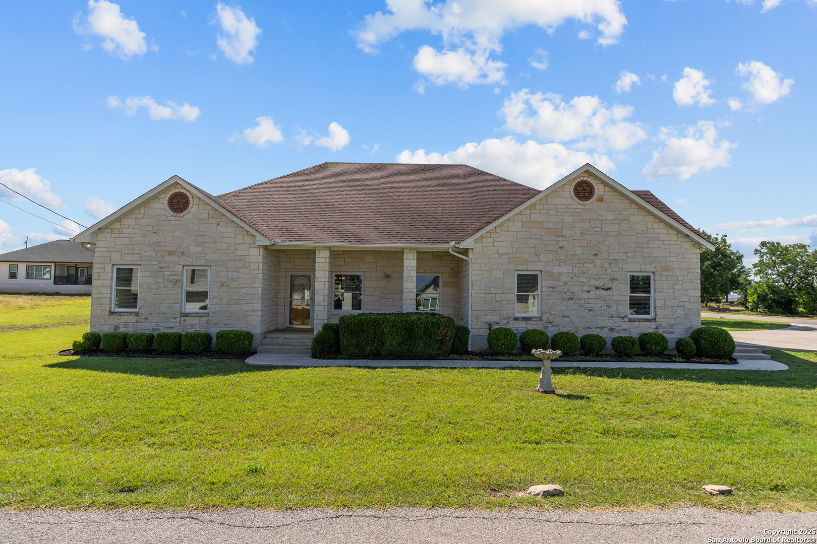 174 Edgewood Circle Bandera, TX 78003 - Photo 33 of 33 a front view of a house with garden