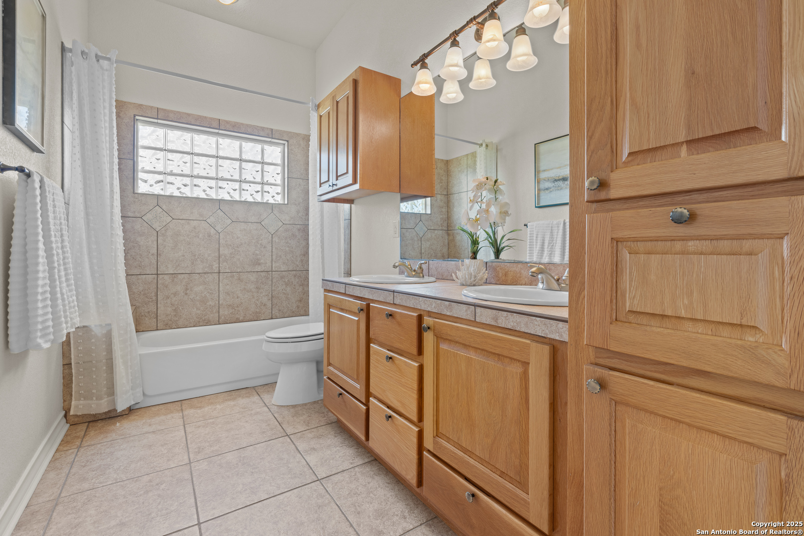 174 Edgewood Circle Bandera, TX 78003 - Photo 10 of 33 a bathroom with a granite countertop sink a toilet and bathtub