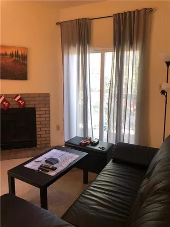 a bedroom with bed and a window