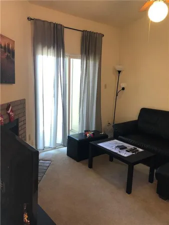 a kitchen with a refrigerator and a stove top oven