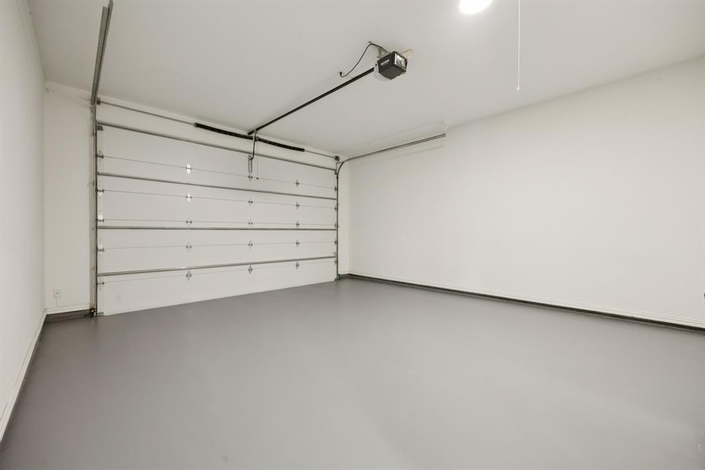 7024 Prairie Ridge Road Argyle, TX 76226 - Photo 38 of 40 Spacious Garage with Fresh Epoxy Flooring Ideal for Trucks and SUVs