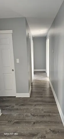 a view of entryway with wooden floor