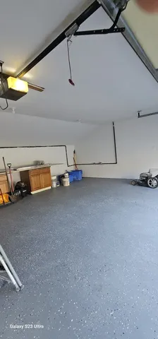 a view of walk in closet with clothes