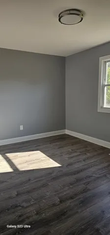 a room with an empty space and a window