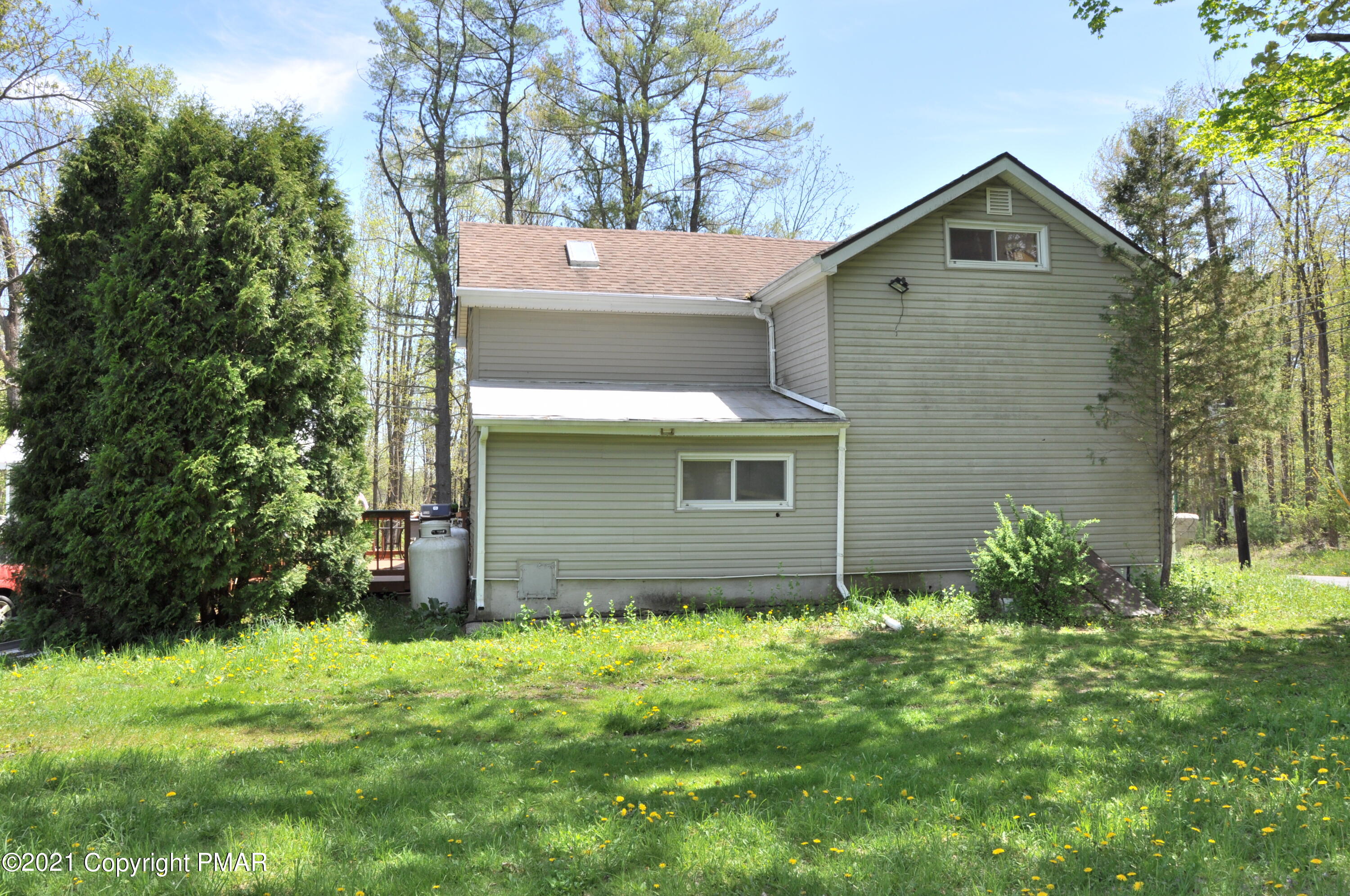 1407 Astolat Road Effort, PA 18330 - Photo 2 of 16 a front view of a house with garden