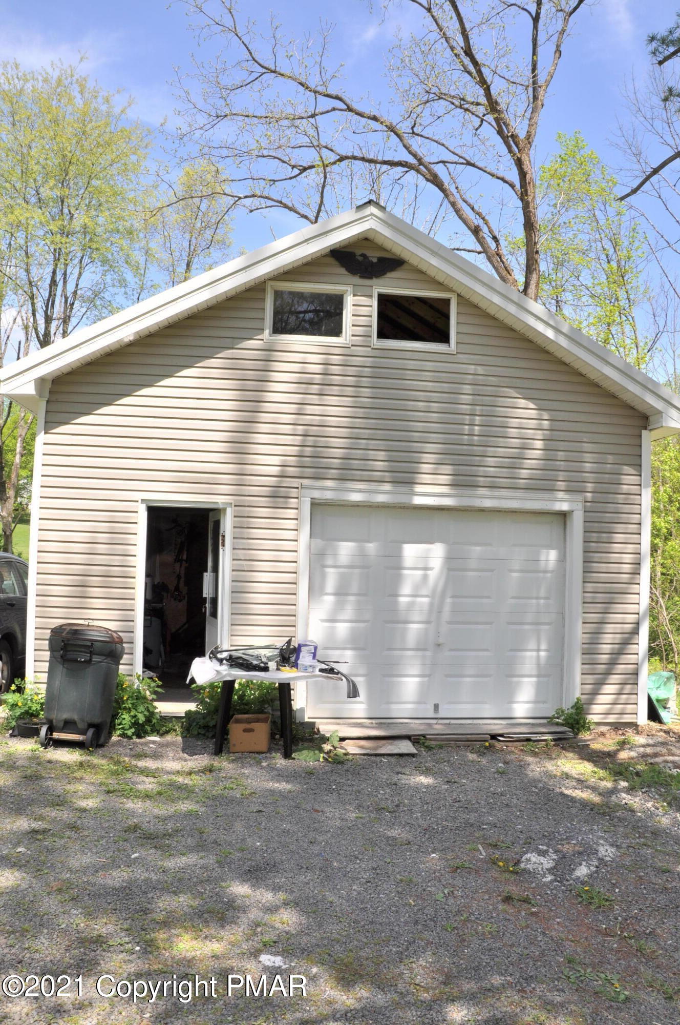 1407 Astolat Road Effort, PA 18330 - Photo 3 of 16 a front view of a house with garage