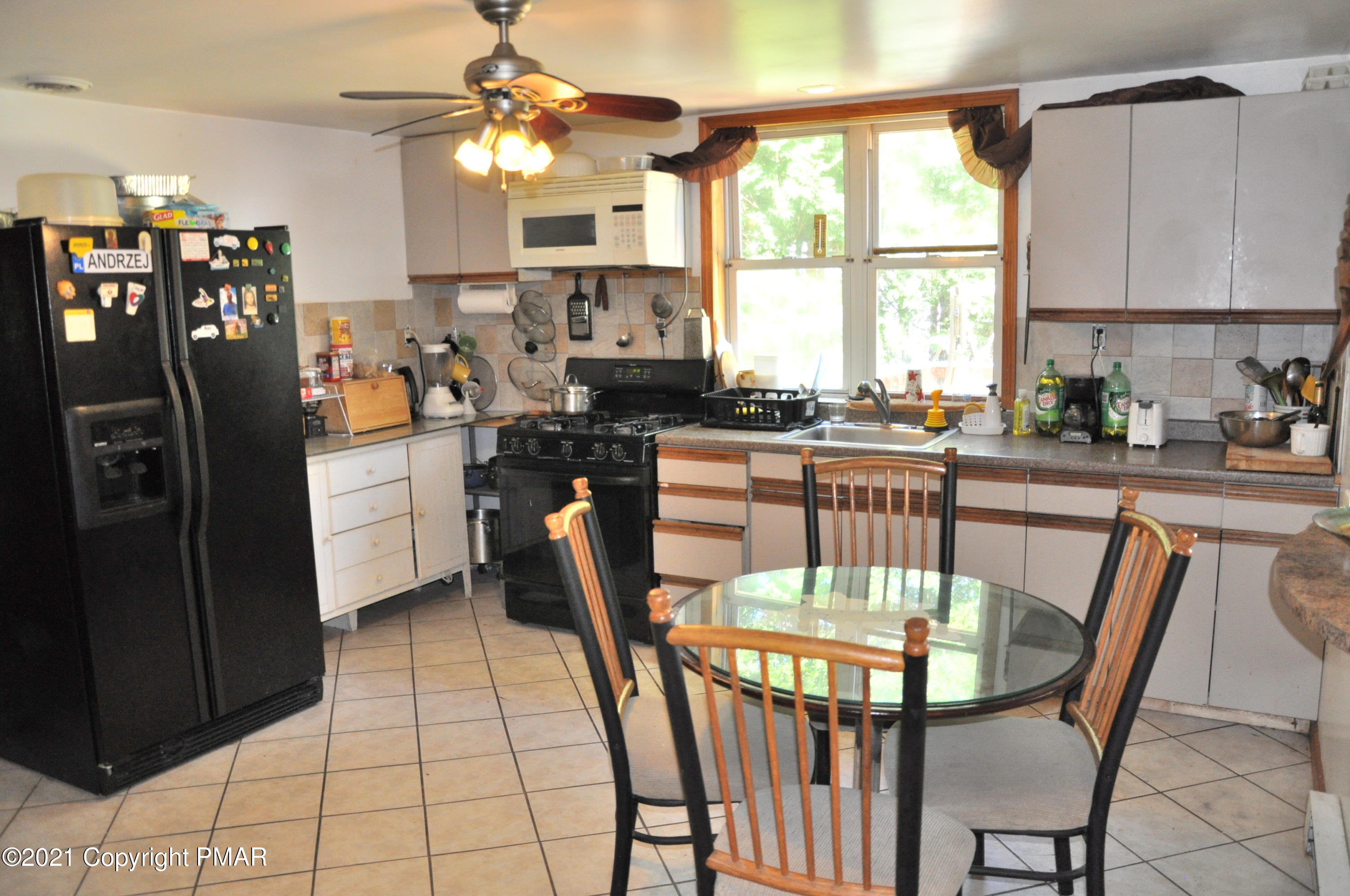 1407 Astolat Road Effort, PA 18330 - Photo 5 of 16 a view of a dining room with furniture window and outside view