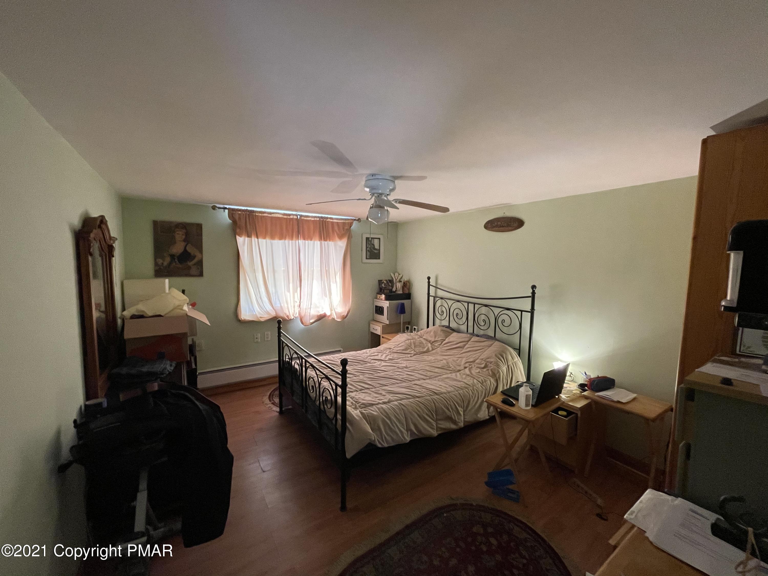 1407 Astolat Road Effort, PA 18330 - Photo 6 of 16 a bedroom with furniture and a window