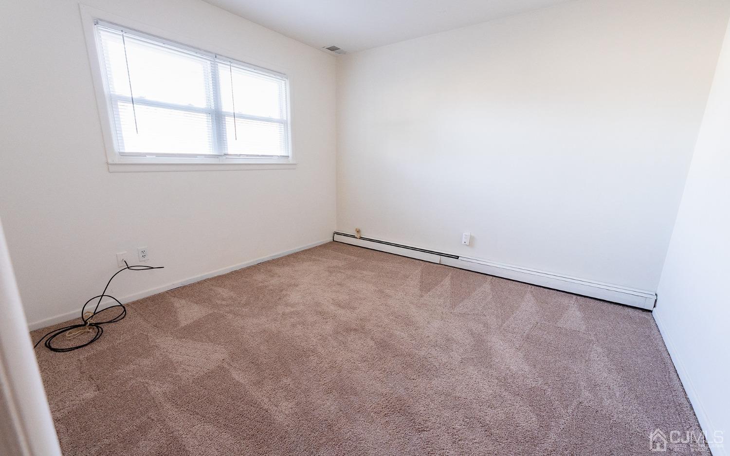 103 Alfred Street Edison, NJ 08820 - Photo 12 of 21 an empty room with a window