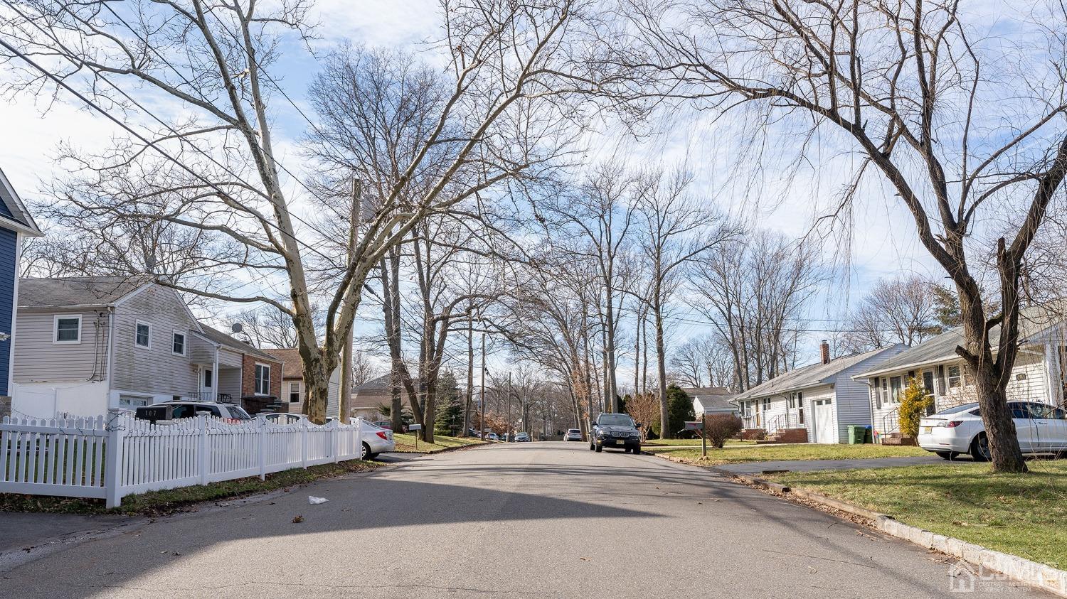 103 Alfred Street Edison, NJ 08820 - Photo 17 of 21 a city street lined with buildings and trees