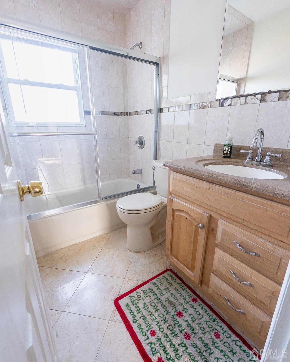 103 Alfred Street Edison, NJ 08820 - Photo 6 of 21 a bathroom with a sink a toilet and shower