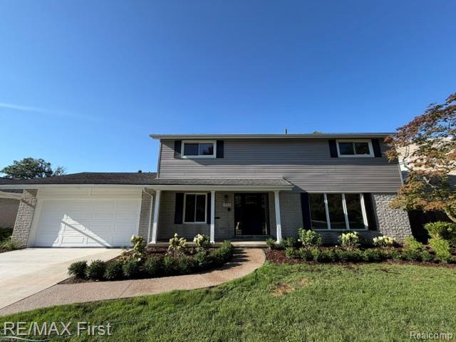 971 Canterbury Road Grosse Pointe, MI 48236 - Photo 2 of 30 Stone and siding exterior with a dark roof