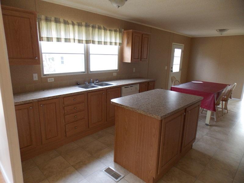 1080 Brake Road Elliston, VA 24087 - Photo 14 of 18 a kitchen with stainless steel appliances granite countertop a sink a stove and a refrigerator