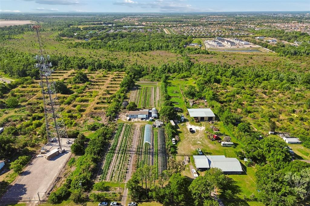 11101 Sumner Road Wimauma, FL 33598 - Photo 29 of 35 an aerial view of residential houses with outdoor space