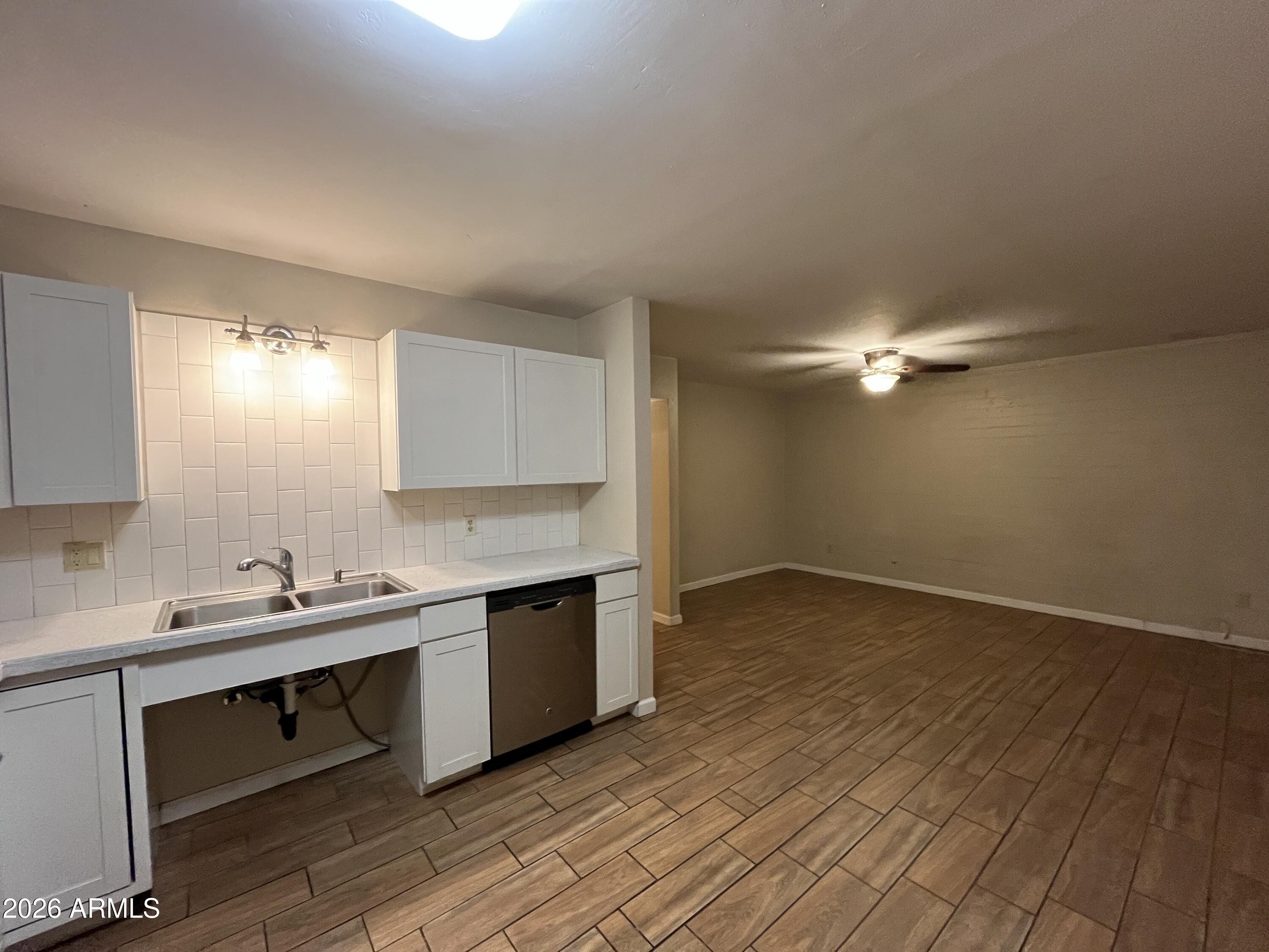 521 West 10th Street, Unit 4 Tempe, AZ 85281 - Photo 5 of 11 a kitchen with a sink cabinets and wooden floor