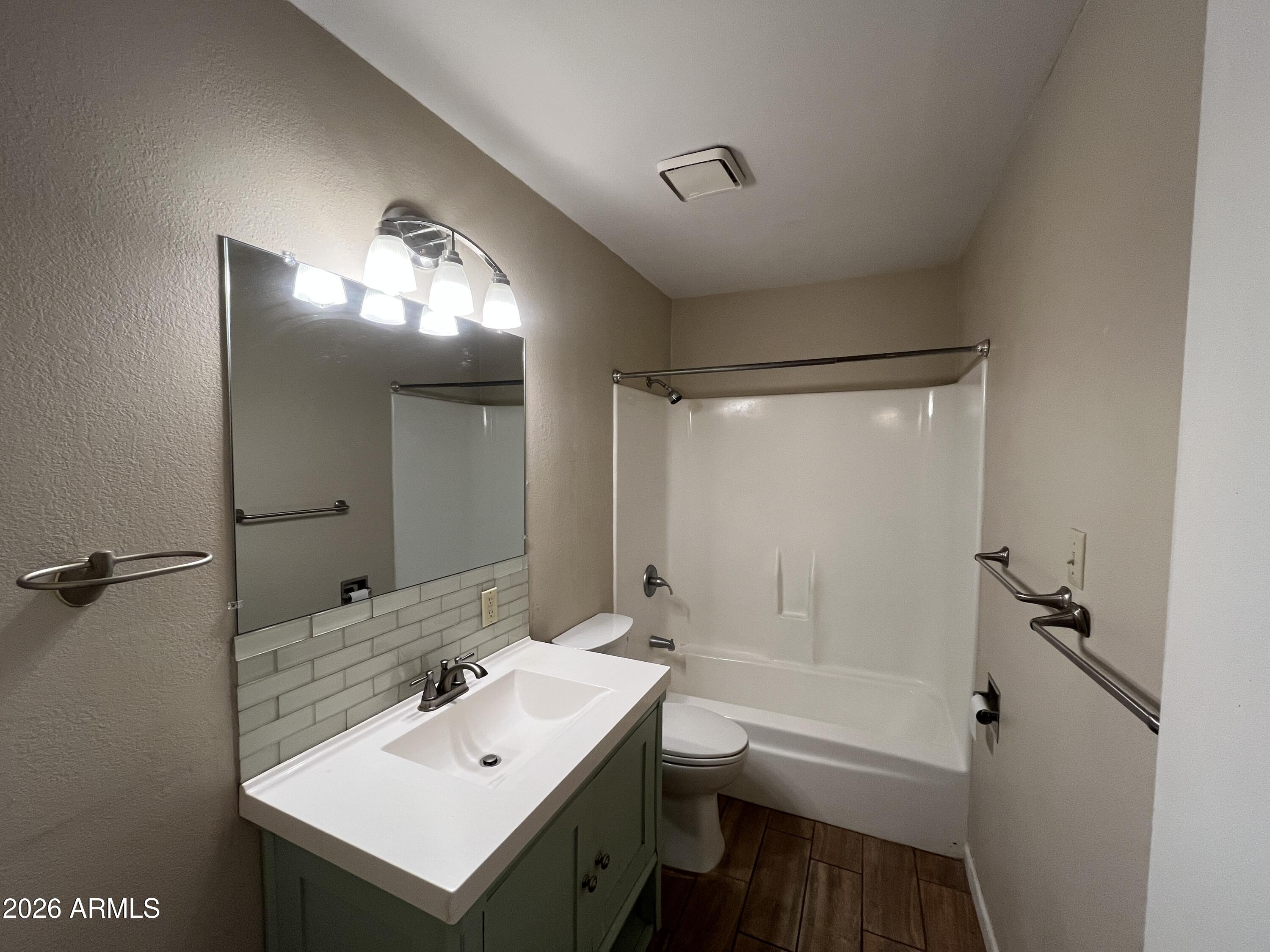 521 West 10th Street, Unit 4 Tempe, AZ 85281 - Photo 7 of 11 a bathroom with a sink toilet and shower