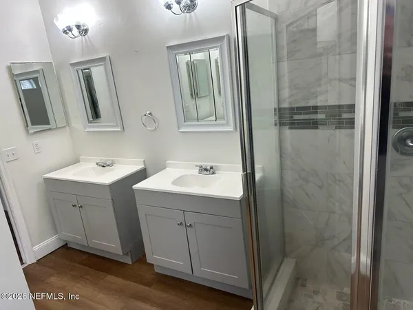 a bathroom with a sink and mirror