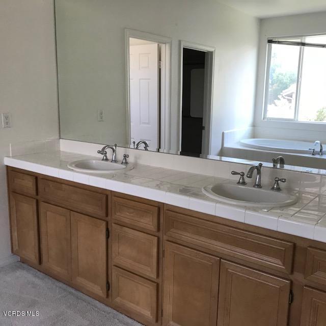 1511 Hidden Ranch Drive Simi Valley, CA 93063 - Photo 12 of 27 a bathroom with a sink and a mirror
